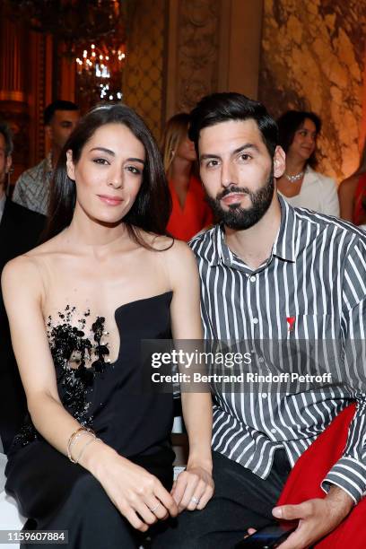 Sofia Essaidi and her husband Adrien Galo attend the Stephane Rolland Haute Couture Fall/Winter 2019 2020 show as part of Paris Fashion Week on July...