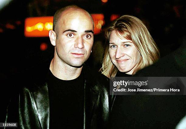 Tennis stars Andre Agassi and Steffi Graf attend the Oscar De La Hoya versus Felix Trinidad welterweight championship fight September 18, 1999 at the...