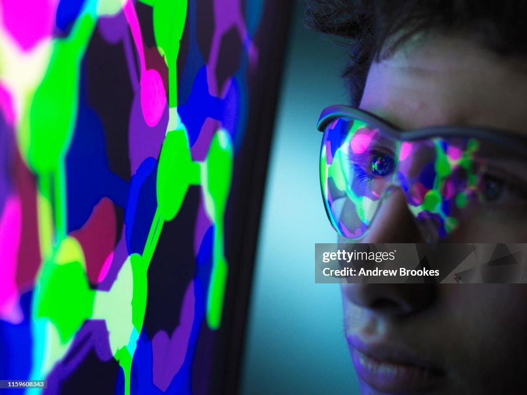 Student understanding the design of a molecular structure on computer screen in laboratory