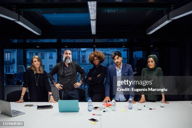 portrait of confident business partners in office - arrogancia fotografías e imágenes de stock