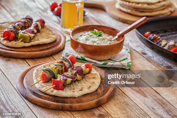 souvlaki, greek grilled meat with veggies - souvlaki stock pictures, royalty-free photos & images