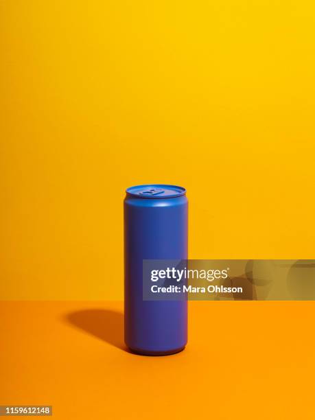 still life with purple drink can and yellow background - cannette photos et images de collection