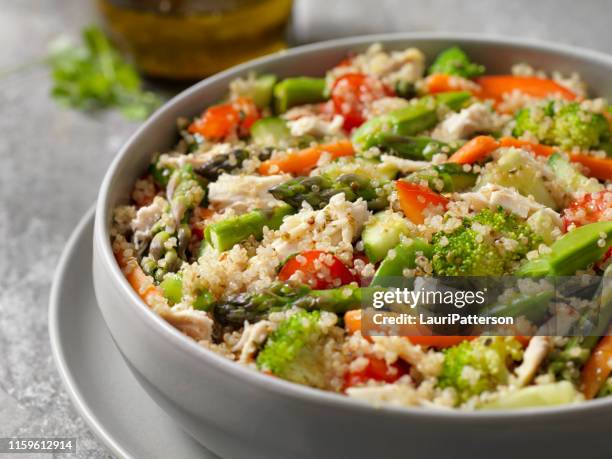 quinoa and chicken salad with a herb oil and vinegar dressing - quinoa stock pictures, royalty-free photos & images