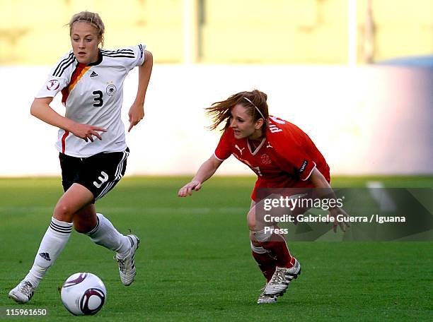 Carolin Simon of Germany competes with Michelle Probst of Switzerland during semifinal game between Germany and Switzerland of Women's Under 19...