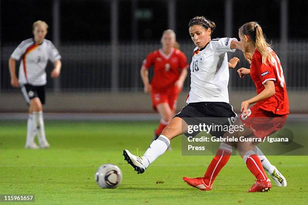 Anja Hegenauer of Germany competes with Gwendoline Fai of Switzerland during semifinal game between Germany and Switzerland of Women's Under 19...