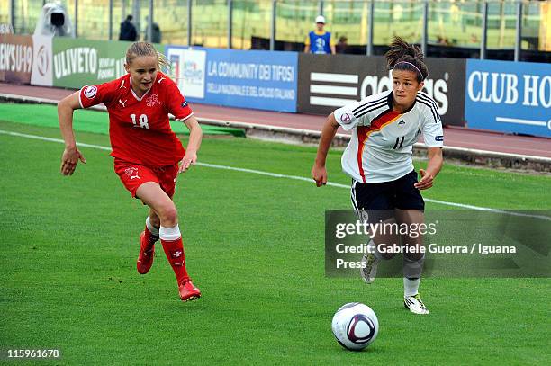 Lena Lotzen of Germany competes with Natasha Gensetter of Switzerland during semifinal game between Germany and Switzerland of Women's Under 19...