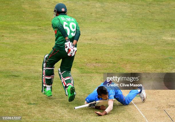 Yuzvendra Chahal of India is hit in the face by the bat of Soumya Sarkar of Bangladesh during the Group Stage match of the ICC Cricket World Cup 2019...