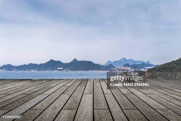 wood table top on blue beach background - food table edge stock pictures, royalty-free photos & images