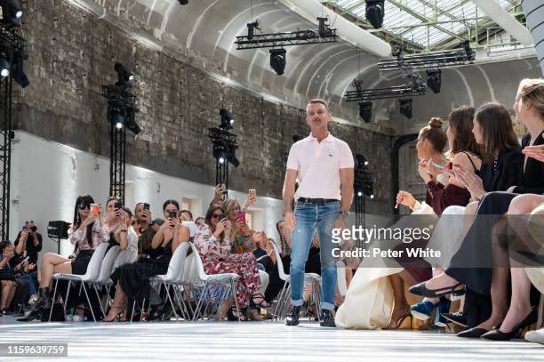 Designer Alexandre Vauthier acknowledges the applause of the public after the Alexandre Vauthier Haute Couture Fall/Winter 2019 2020 show as part of...