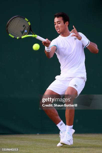 Hugo Dellien of Bolivia plays a forehand in his Men's Singles first round match against John Millman of Australia during Day two of The Championships...