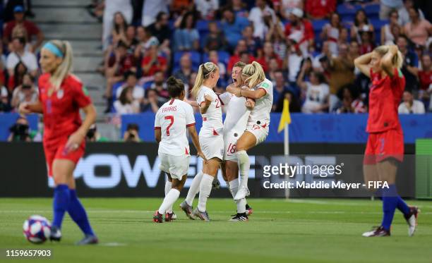 Ellen White of England celebrates with teammates after scoring her team's first goal during the 2019 FIFA Women's World Cup France Semi Final match...