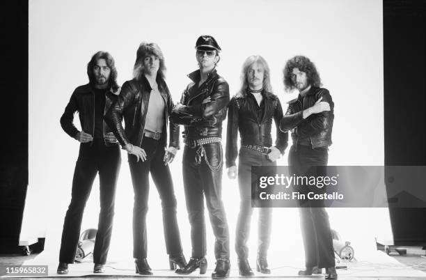 Judas Priest , British heavy metal band, pose against a white background, wearing black leather clothing, in a group studio portrait, circa 1978.