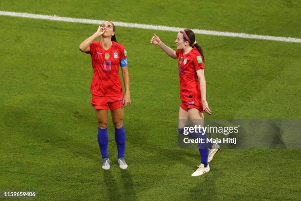 Alex Morgan of the USA celebrates with teammate Rose Lavelle after scoring her team's second goal during the 2019 FIFA Women's World Cup France Semi...