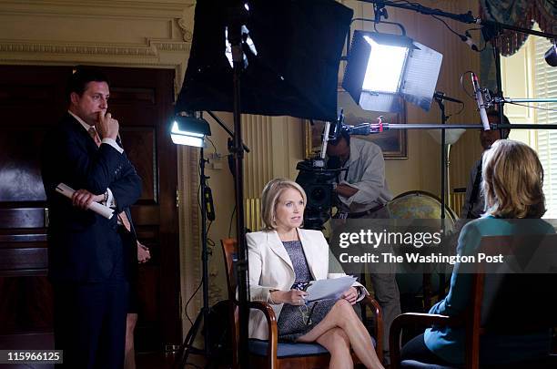 Philippe I. Reines observes as United States Secretary of State Hillary Clinton is interviewed by Katie Couric in Washington, D.C. On May 19, 2011....