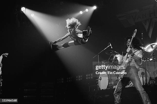 David Lee Roth, singer with Van Halen, jumping in mid-air alongside guitarist Eddie Van Halen during a live concert performance by the US rock band...