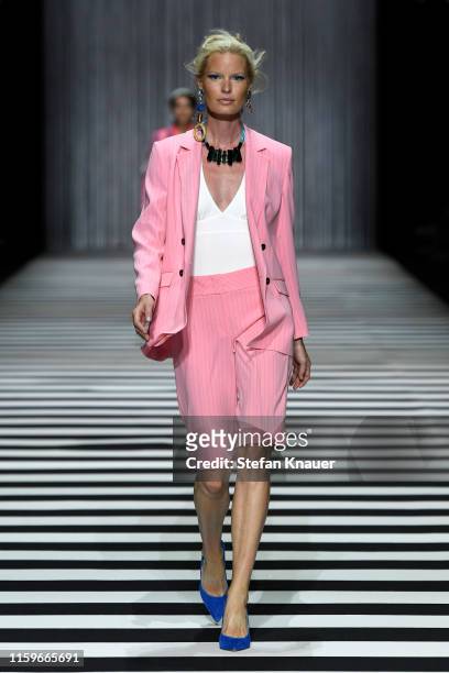 Caroline Winberg walks the runway at the Marc Cain fashion show during the Berlin Fashion Week Spring/Summer 2020 at Velodrom on July 02, 2019 in...