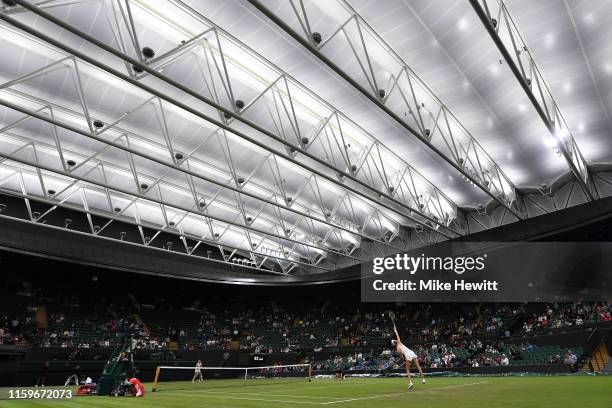 Alison Riske of USA serves under the new Court 1 roof during her 1st round match against Donna Vekic of Croatia on Day 2 of The Championships -...