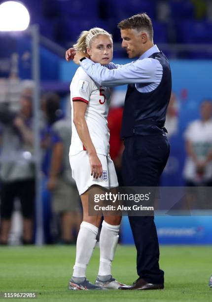 Philip Neville, Head Coach of England consoles Steph Houghton of England following the 2019 FIFA Women's World Cup France Semi Final match between...