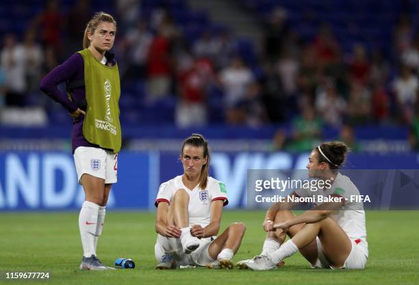 Karen Carney, Jill Scott and Jodie Taylor of England look dejected following the 2019 FIFA Women's World Cup France Semi Final match between England...