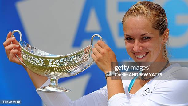 Germany's Sabine Lisicki holds the Maud Watson trophy after beating Slovakia's Daniela Hantuchova 6-3 6-2 during the final of the WTA AEGON Classic...