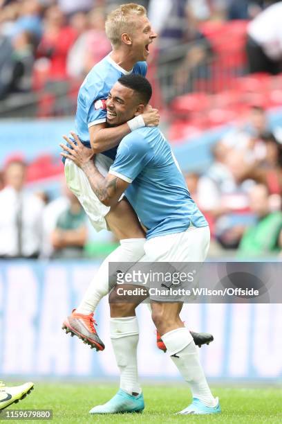 Gabriel Jesus of Man City celebrates scoring the winning penalty with Oleksandr Zinchenko during the FA Community Shield between Liverpool and...