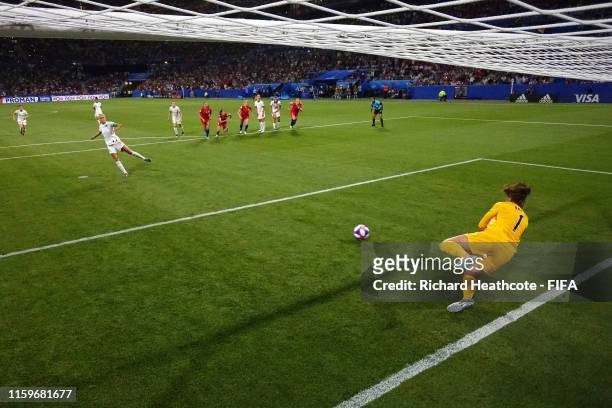Alyssa Naeher of the USA saves a penalty from Steph Houghton of England during the 2019 FIFA Women's World Cup France Semi Final match between...