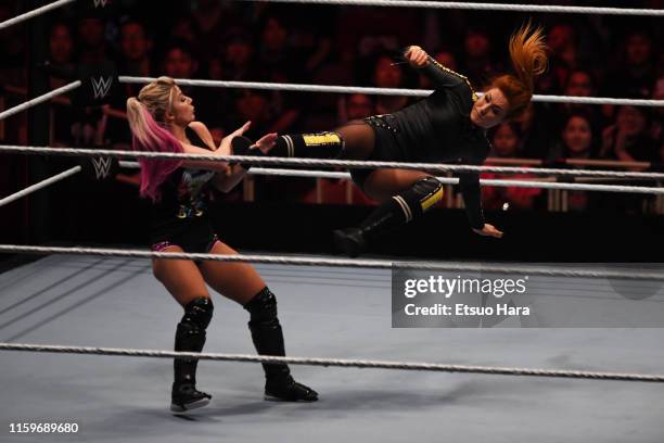 Becky Lynch and Alexa Bliss compete during the WWE Live Tokyo at Ryogoku Kokugikan on June 29, 2019 in Tokyo, Japan.