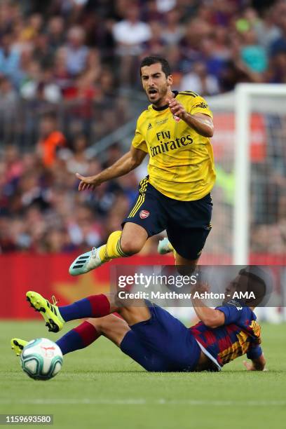 Jordi Alba of FC Barcelona fouls Henrikh Mkhitaryan of Arsenal during the Pre-Season Friendly between FC Barcelona and Arsenal at Nou Camp on August...
