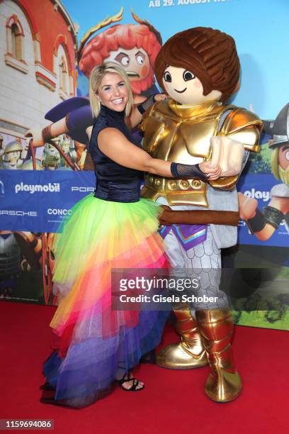 Beatrice Egli wearing a rainbow skirt during the premiere of the movie "Playmobil der Film" at Mathaeser Filmpalast on August 4, 2019 in Munich,...