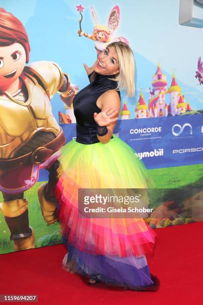Beatrice Egli wearing a rainbow skirt during the premiere of the movie "Playmobil der Film" at Mathaeser Filmpalast on August 4, 2019 in Munich,...