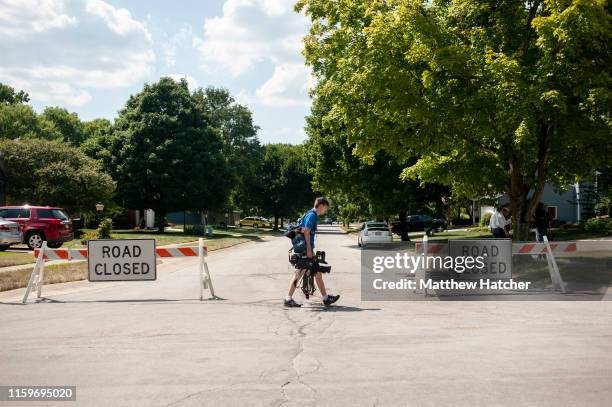 Media crews gather near the street where the suspect in a mass shooting is believed to have a residence on August 4, 2019 in Bellbrook, Ohio. In the...