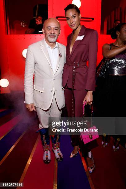 Christian Louboutin and Cindy Bruna attend Loubhoutan Express presentation at La Garde Republicaine on July 02, 2019 in Paris, France.