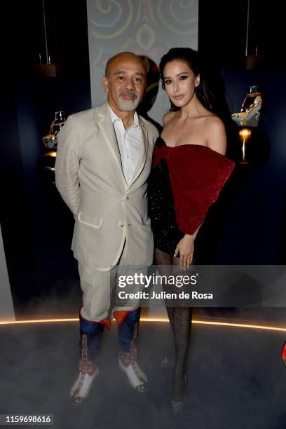 Christian Louboutin and Sririta Jensen attend Loubhoutan Express presentation at La Garde Republicaine on July 02, 2019 in Paris, France.