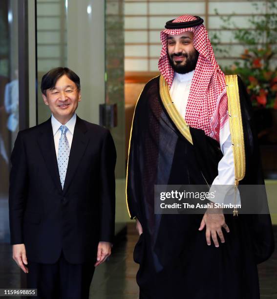 Crown Prince Mohammad Bin Salman Al Saud of Saudi Arabia is welcomed by Emperor Naruhito prior to their meeting at the Akasaka Palace on July 2, 2019...