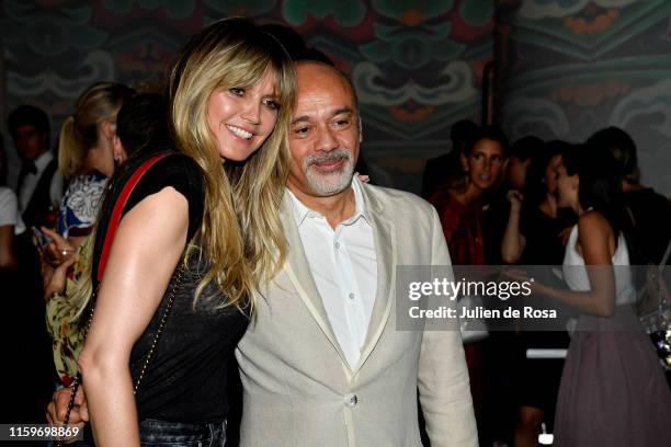 Heidi Klum and Christian Louboutin attend Loubhoutan Express presentation at La Garde Republicaine on July 02, 2019 in Paris, France.