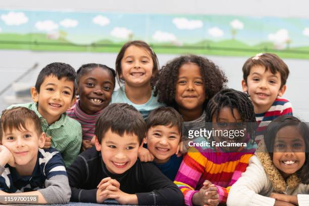 close friends in class portrait - children only stock pictures, royalty-free photos & images