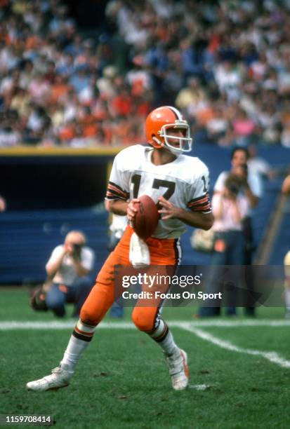 Brian Sipe of the Cleveland Browns drops back to pass during an NFL football game circa 1981 at Municipal Stadium in Cleveland, Ohio. Sipe played for...