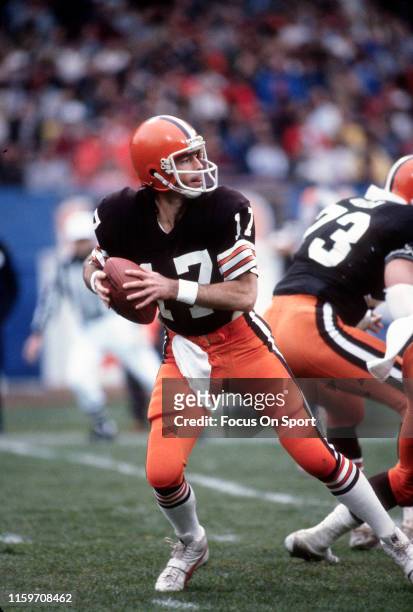 Brian Sipe of the Cleveland Browns drops back to pass during an NFL football game circa 1982 at Municipal Stadium in Cleveland, Ohio. Sipe played for...