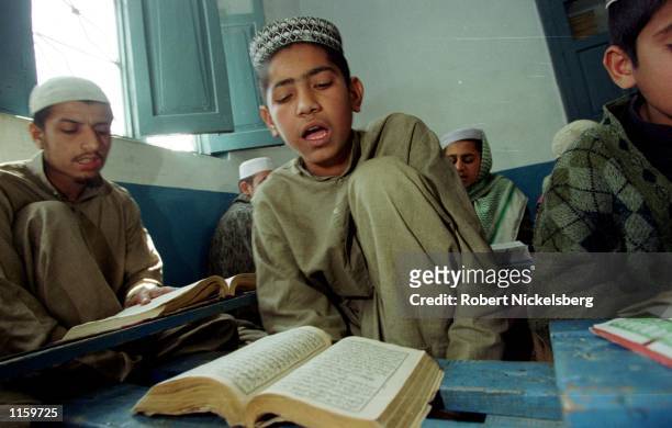 Madrassa students work to memorize the Koran February 12, 2001 in Akora Khatak, Pakistan. Madrassa Haqqania, one of Pakistan's renowned Islamic...