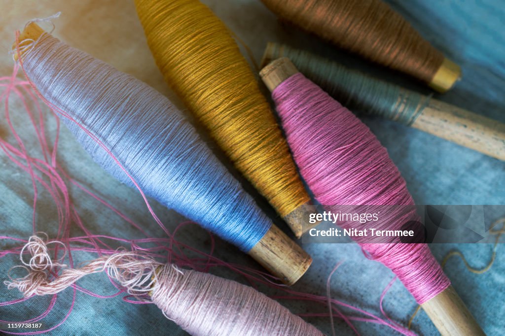 Colorful Raw silk thread to work natural textile fiber art of the household industry. Can be seen in the countryside of Thailand.
