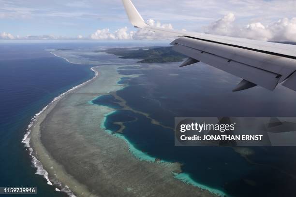 Secretary of State Mike Pompeo's plane makes its landing approach at Pohnpei International Airport in Kolonia on August 5, 2019.