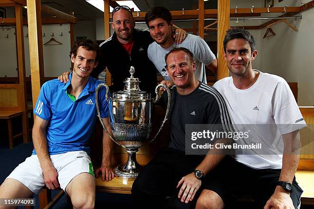 Andy Murray of Great Britain celebrates with his trophy in the dressing room with his coaching staff Jez Green, Daniel Vallverdu, Matt Little and...