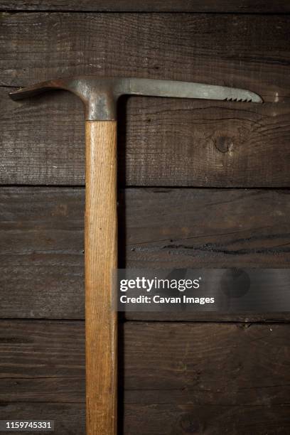 old ice-axe on a wood table - ice pick ストックフォトと画像