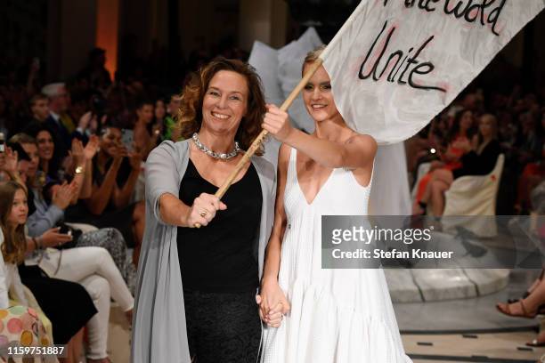 Designer Anja Gockel and a model at the Anja Gockel show during the Berlin Fashion Week Spring/Summer 2020 at Hotel Adlon on July 02, 2019 in Berlin,...