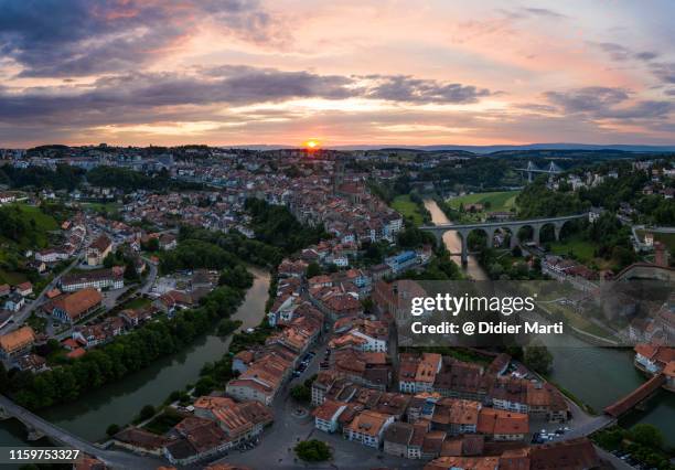 dramatic sunset over fribourg, switzerland - freiburg skyline stock pictures, royalty-free photos & images