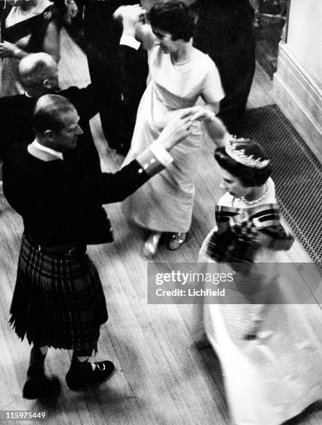 Queen Elizabeth II and the Duke of Edinburgh dancing at the Ghillies Ball on her Balmoral estate in Scotland, 1972. Prince Philip wears the Balmoral...