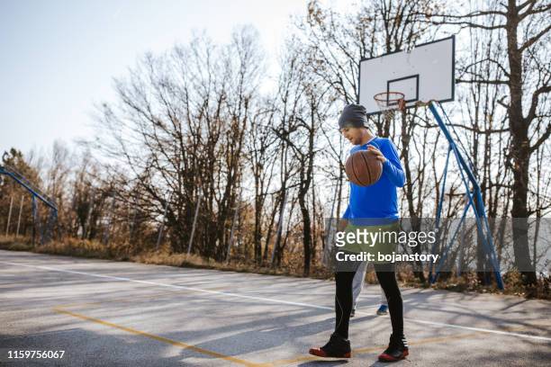 having fun on basketball court - basketball court stock pictures, royalty-free photos & images