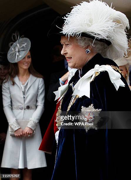 Queen Elizabeth II is watched by Catherine, Duchess of Cambridge as she proceeds during the Order of the Garter Service on June 13, 2011 in Windsor,...