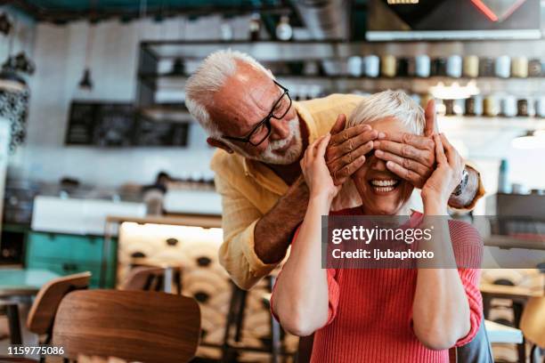 romance level: expert - hands covering eyes stock pictures, royalty-free photos & images