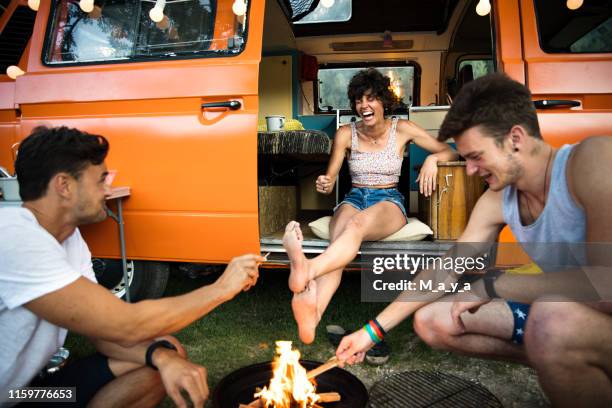 camping friends - orange car stock pictures, royalty-free photos & images